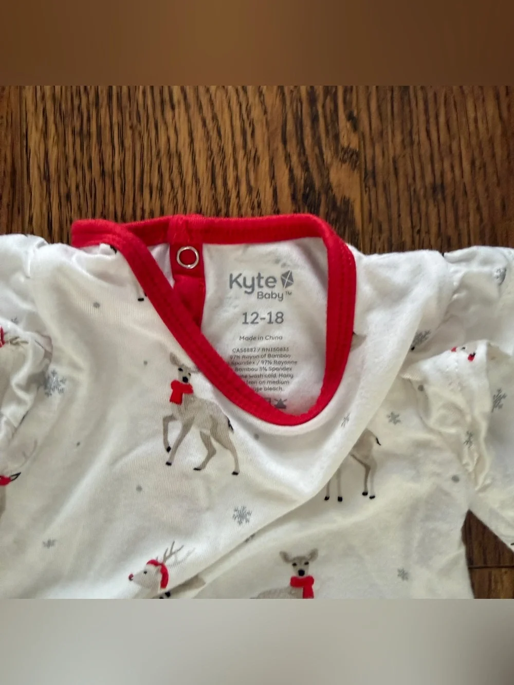 Kyte Baby Twirl Bodysuit in White Reindeer print 12-18mo